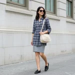 2025 Wardrobe: 7 Essential Style Updates for Modern American Look Modern American woman showcasing 2025 fashion trends in an urban setting